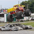 Monster truck flying through the air.